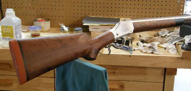 Shaped and sealed stock with recoil pad on a single shot rifle